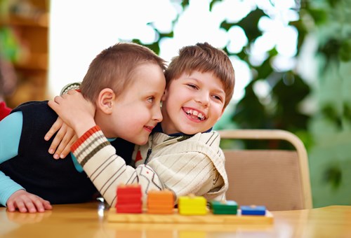 Two boys playing with toys