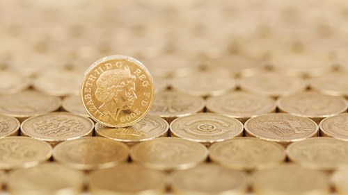 A close up photo of lots of pound coins