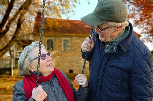 Older couple on a swing
