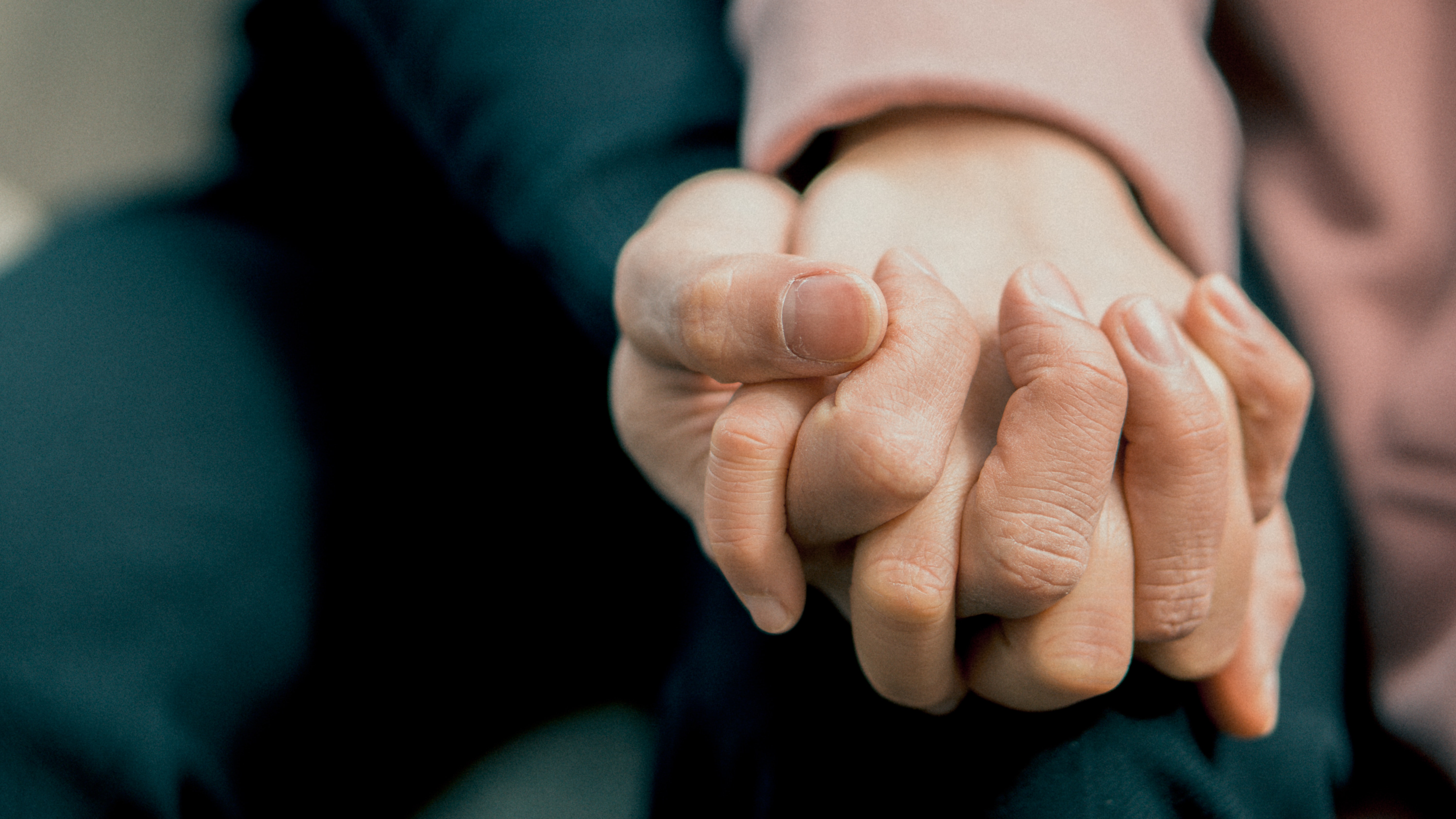 An image of people holding hands