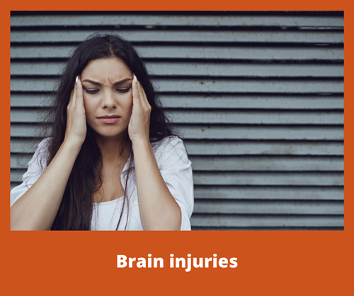 A woman holding her head in pain