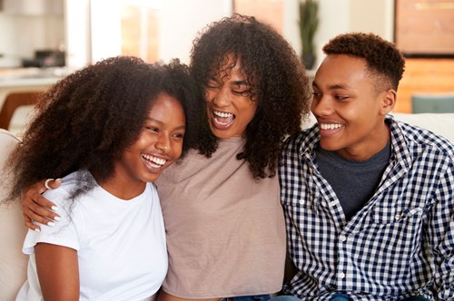 a group of siblings laughing together