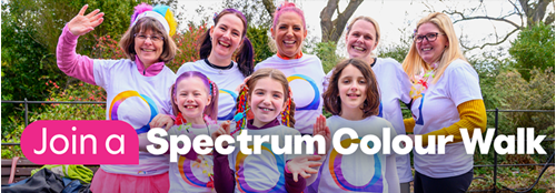 People in colourful outfits for the spectrum walk