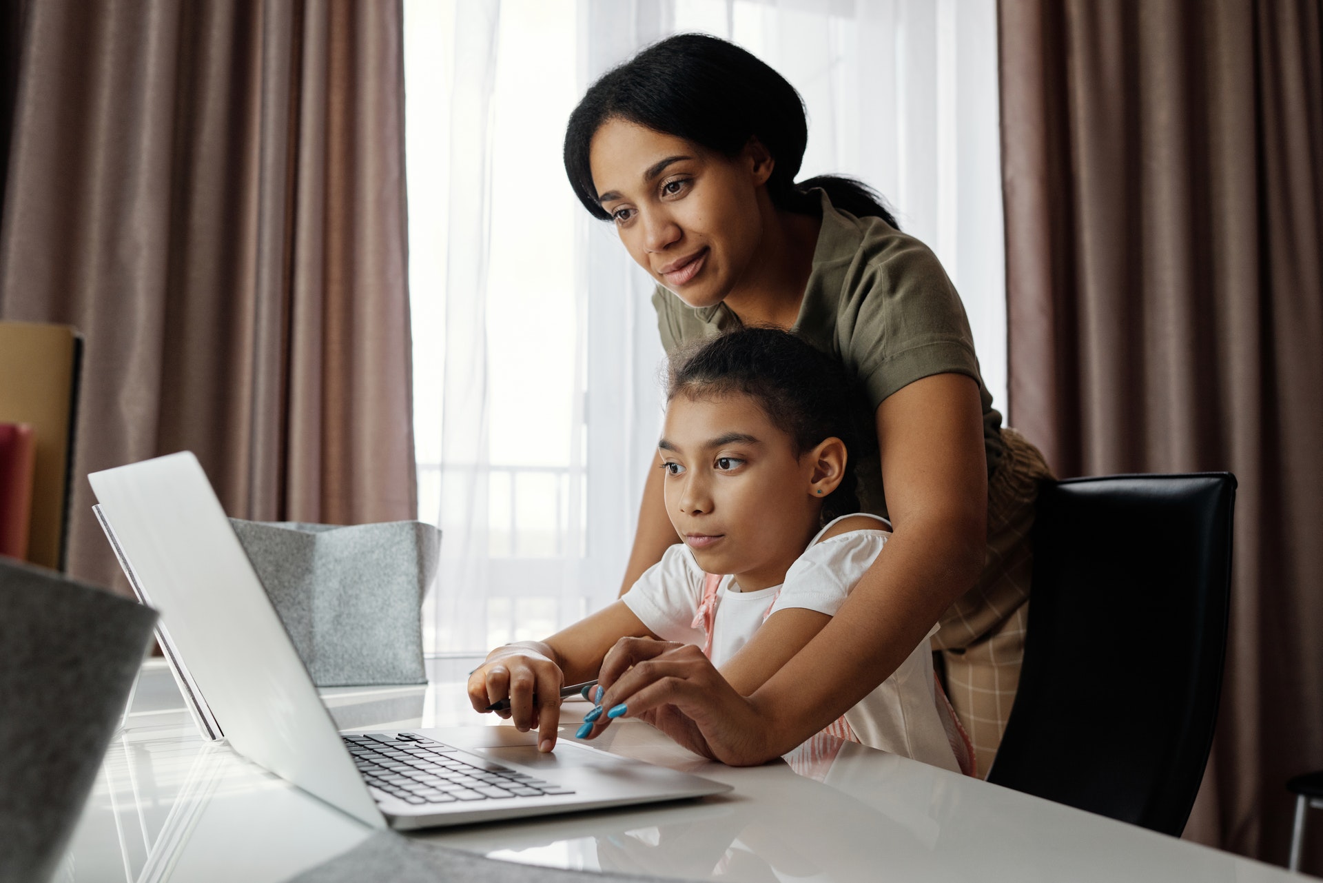 A mother and daughter home schooling